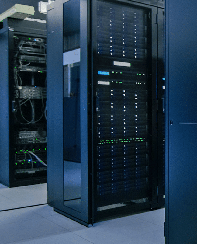 A server surrounded by electronics hums inside a computer room.