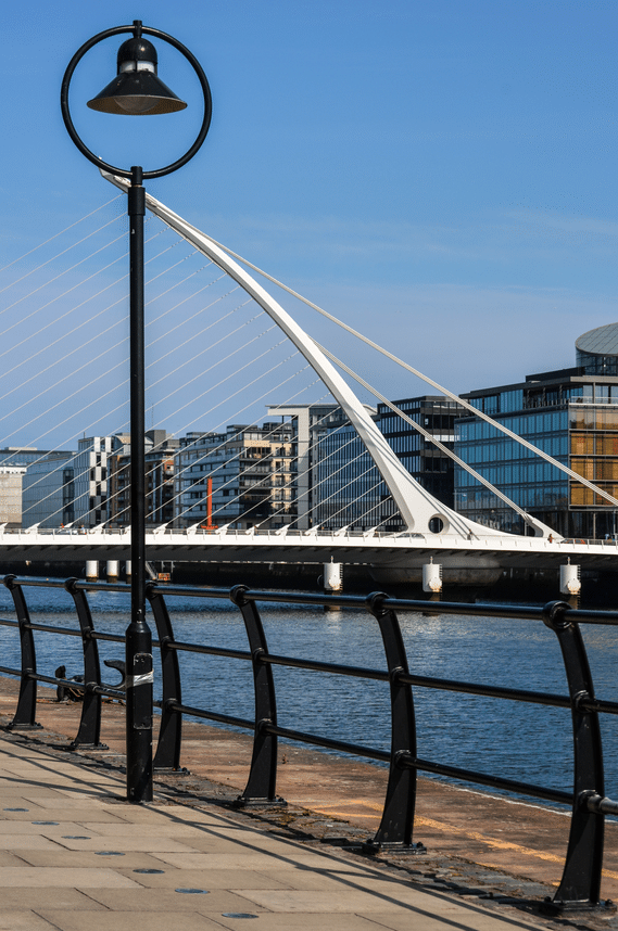 A picture of the view from the sidewalk of the Samuel Beckett Bridge in Dublin's Docklands.