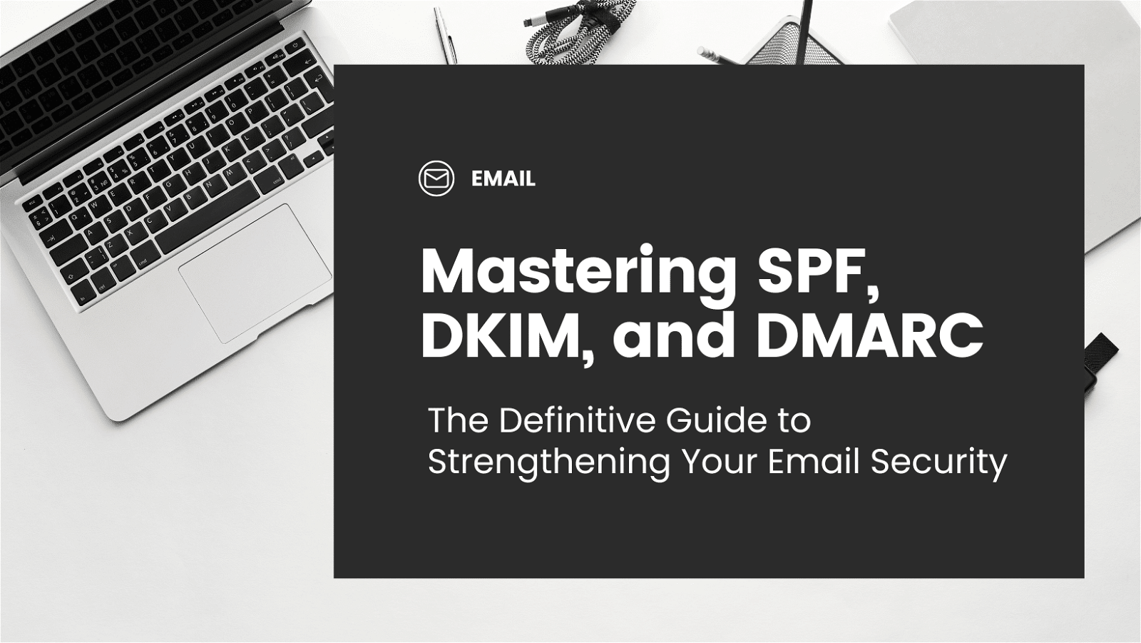 Modern workspace featuring a laptop and a guide on email security focusing on SPF, DKIM, and DMARC.